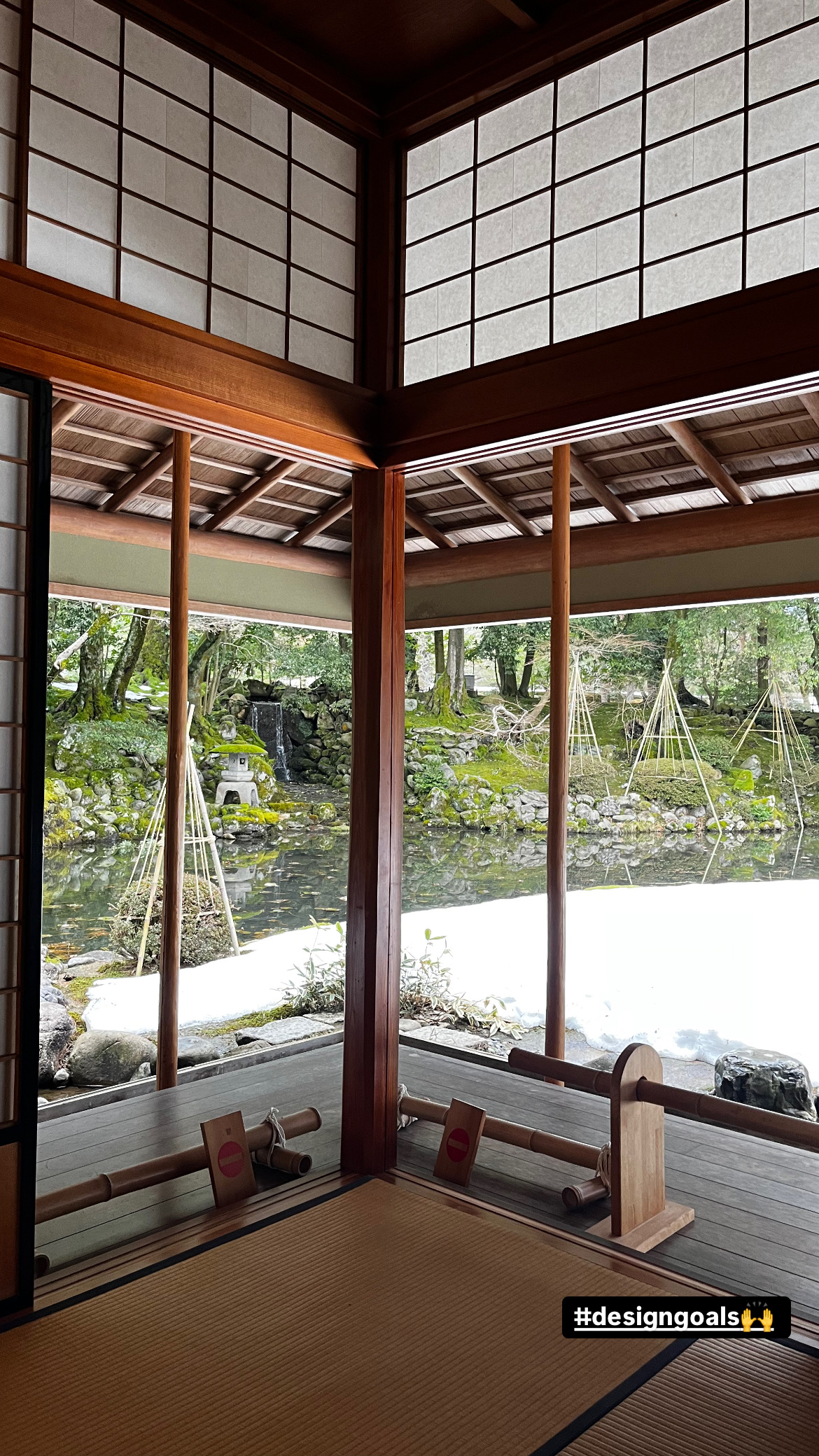 View from inside a traditional Japanese teahouse looking out at Kenrokuen Garden in winter, Kanazawa