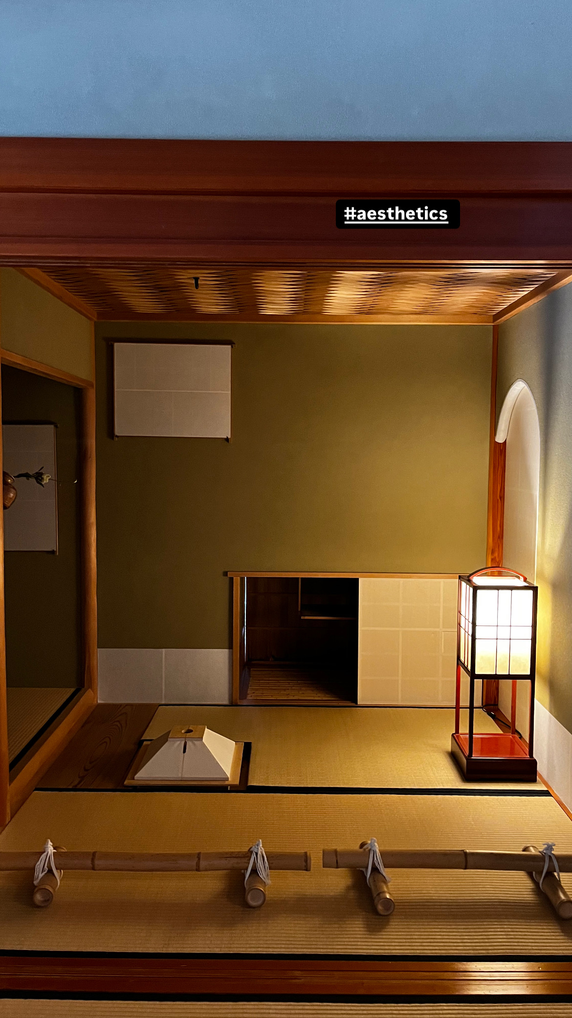 Traditional tatami room with glowing andon lamp at Shigure-tei teahouse Kenrokuen Garden Kanazawa