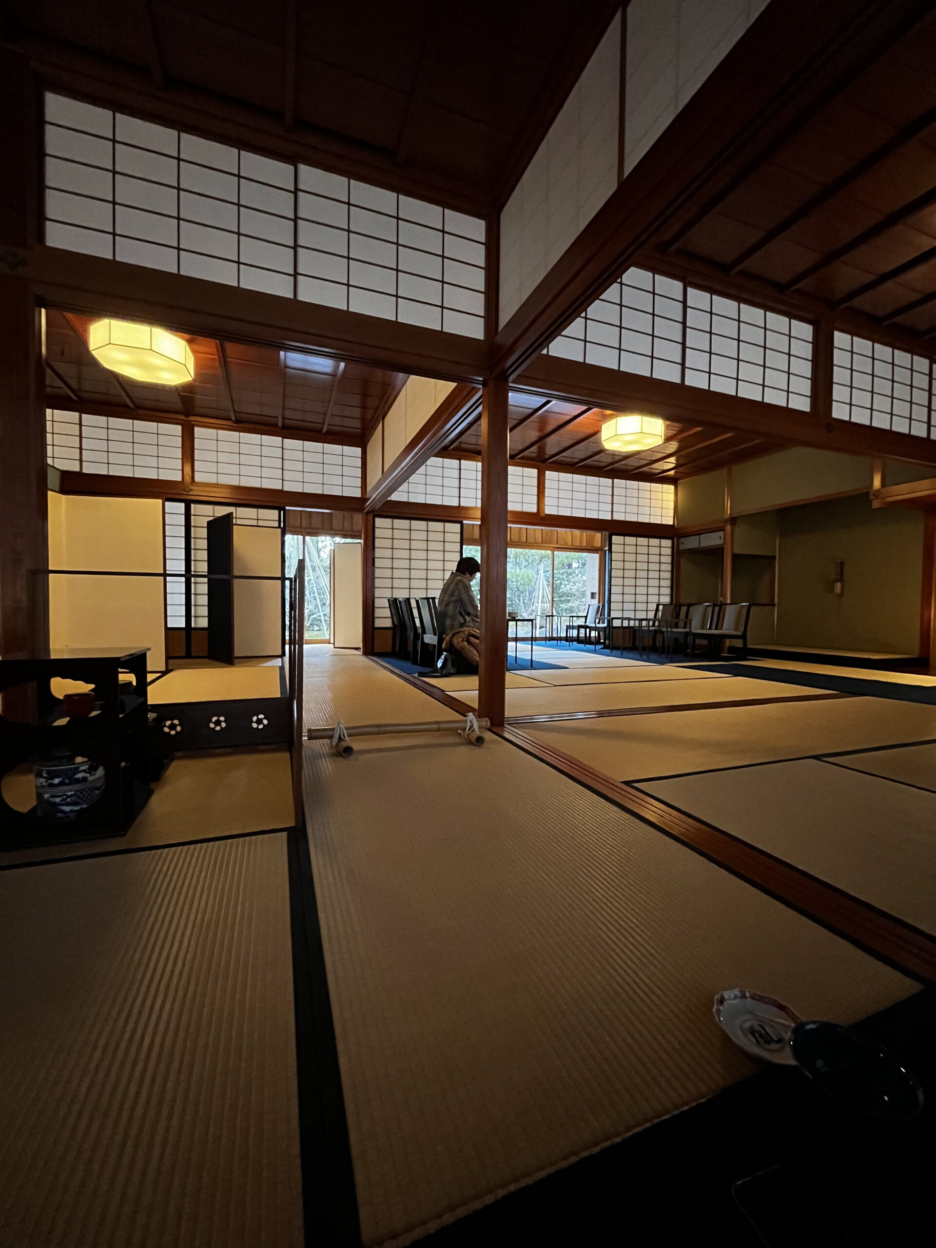 Grand tatami hall at Shigure-tei teahouse Kenrokuen Garden Kanazawa with shoji screens and lantern light