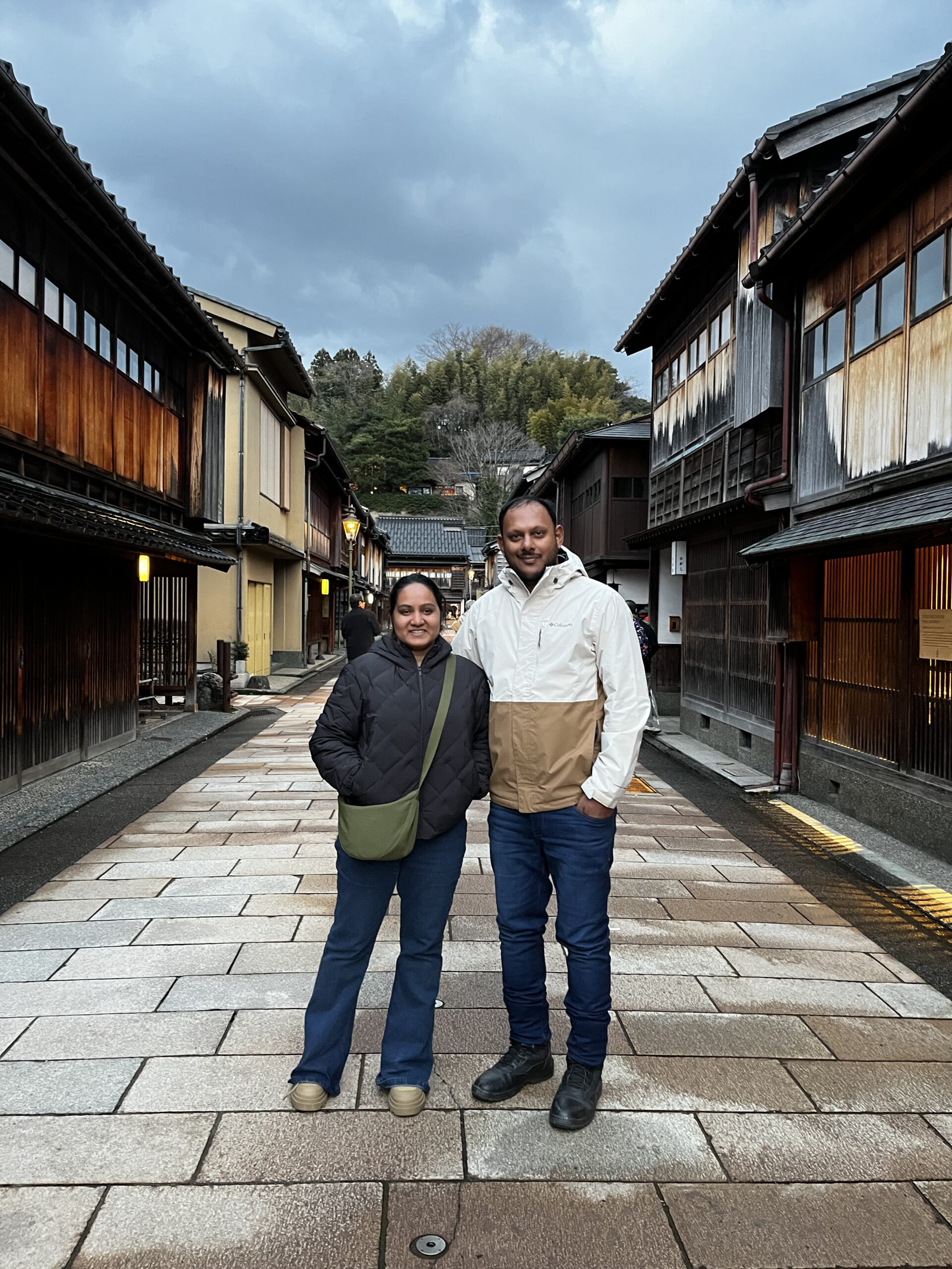 Higashi Chaya geisha district in Kanazawa — dark timber teahouses lining the historic cobblestone street at dusk